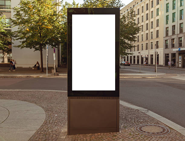 istock Digital city billboard mockup with blank white screen in urban environment 2253649199