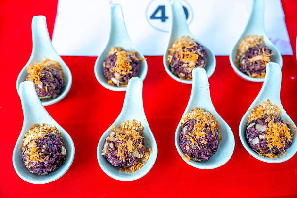 Vegetarian dish: Black Sticky Rice with various beans, skillfully arranged on the table. A favorite Vietnamese dish.