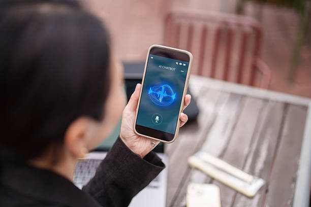 istock Woman Using Smartphone with AI Interface at Outdoor Work Table 2253653130