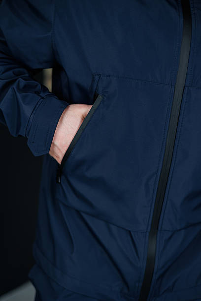 istock The Modern Stylish Navy Jacket comes equipped with Functional Pockets, making it perfect for various Outdoor Activities like hiking, running, or casual outings, offering both comfort and style 2253656698