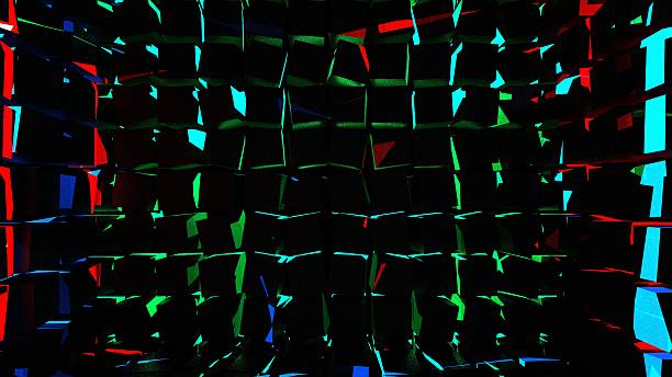 istock 3D render, virtual space. Aligned and rotated arrangement of cubes forming walls to create another cube-shaped space that encompasses everything with colored lights that impact from the outside. 2253657291