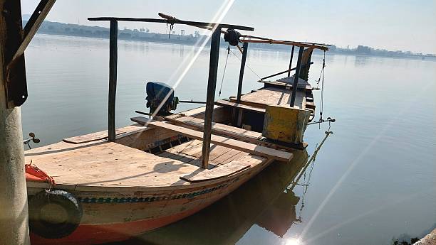 istock Traditional wooden beri boat floating on Indus River Kalabagh 2253660573