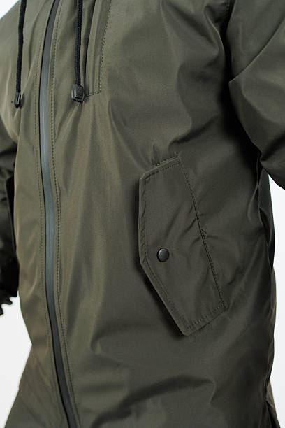 istock A person is wearing a stylish green jacket that features a black zipper 2253660721
