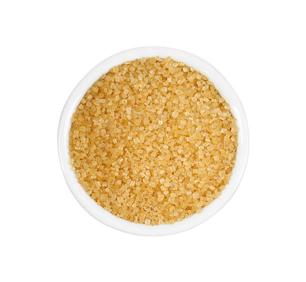 istock Brown sugar in bowl isolated on white, top view 2253663536