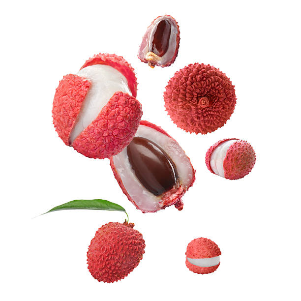istock Many lychees falling on white background. Exotic fruit 2253664456