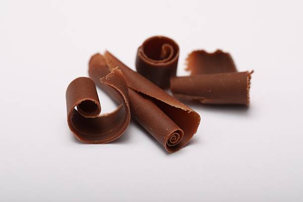 istock Many tasty chocolate shavings on white background 2253667532