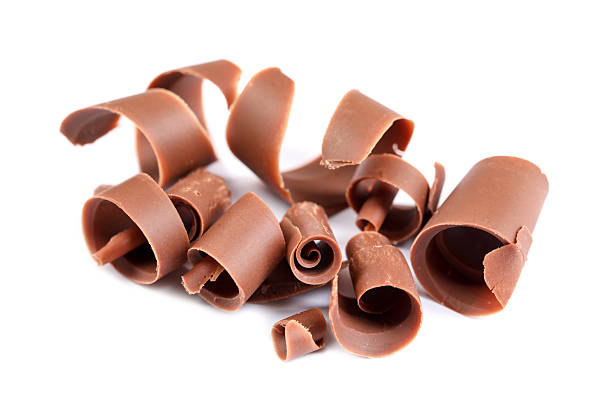 istock Many delicious chocolate shavings isolated on white 2253667533