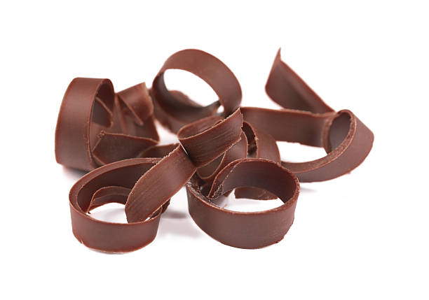 istock Many delicious chocolate shavings isolated on white 2253667598