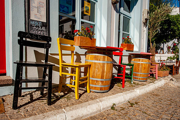 Bozcaada, Türkiye - August 07, 2011 : Colorful tables and chairs in Bozcaada