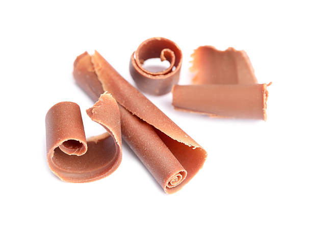 istock Many tasty chocolate shavings on white background 2253667729