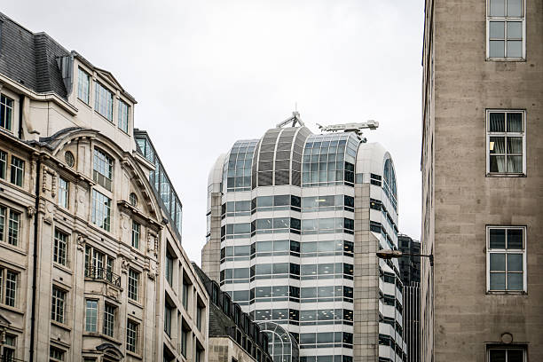 istock Modern Office Tower Surrounded by Historic City Buildings 2253668980