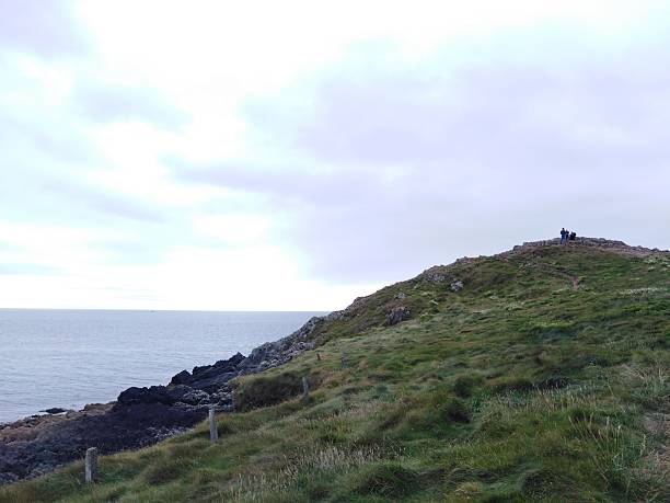 istock People Looking over Water in Ballycotton 2253669080