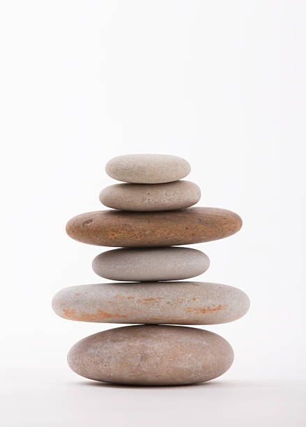istock Zen Stack of Smooth Stones Against White Background 2253669182