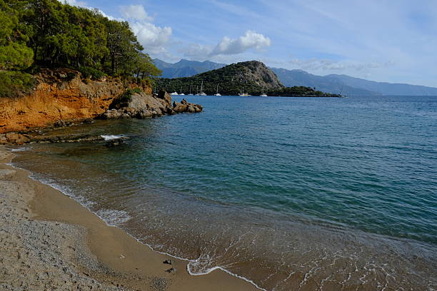 Quiet tranquil beach in Fethiye, Turkey on sunny day
