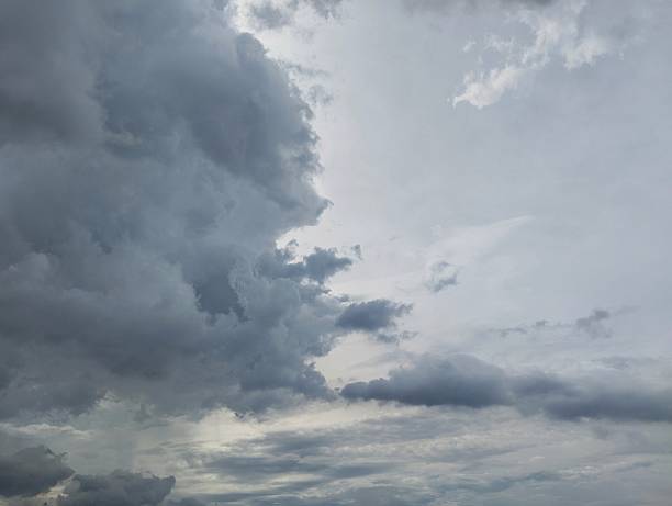 istock Dramatic swirling storm clouds in gray overcast sky 2253672882