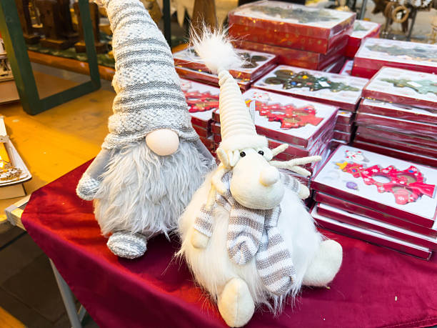 Festive gnome plushies on display at holiday market