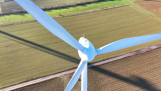 istock Aerial Wind Turbine Casting Shadow Across Agricultural Fields 2253675261