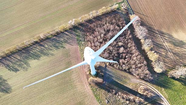 istock Aerial Wind Turbine Casting Shadow Across Agricultural Fields 2253675267