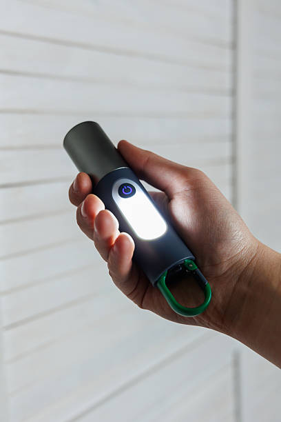 istock Stylishly designed handheld flashlight with a convenient carabiner for easy carrying 2253676897