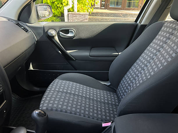 The interior of a compact car showcases comfortable upholstery combined with modern design features, making it an ideal choice for daily commuting and enjoyable travel experiences