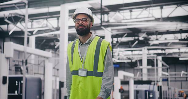 istock Engineer Communicating Via Walkie Talkie in Factory 2253678816