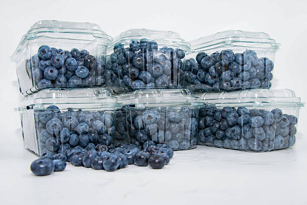 istock Fresh ripe blueberries stored in clear plastic packaging for retail sale 2253680465