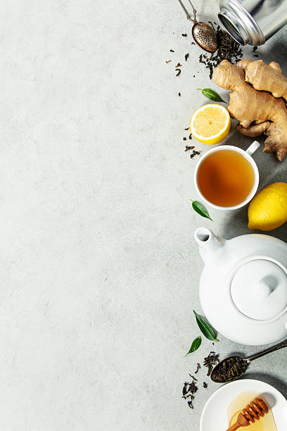 istock Herbal Tea with Ginger, Lemon, and Honey on Light Background 2253681179