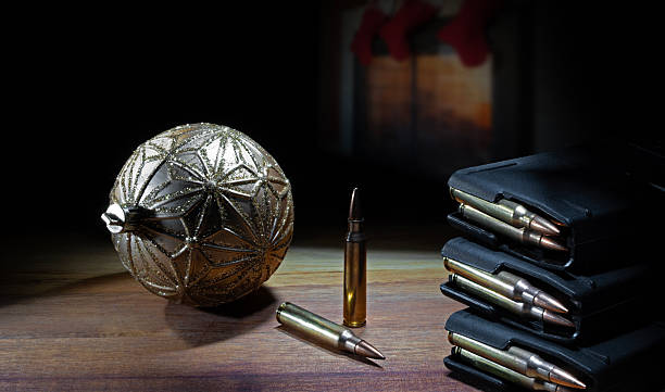 istock Copy space behind a Christmas ornament with loaded gun magazines 2253683392