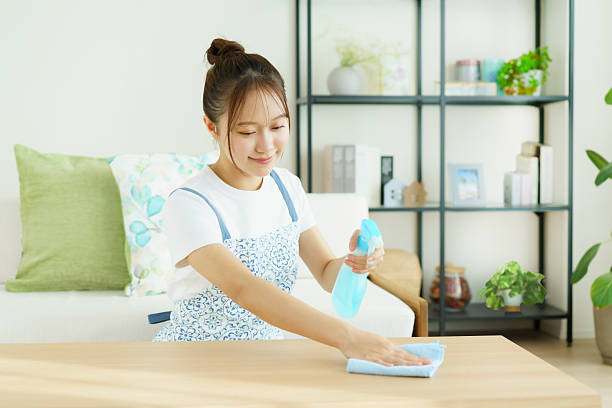 istock A young woman wiping the table 2253684520