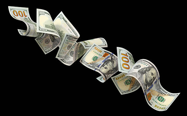 istock Flying hundred dollar bills, isolated on black background 2253689188
