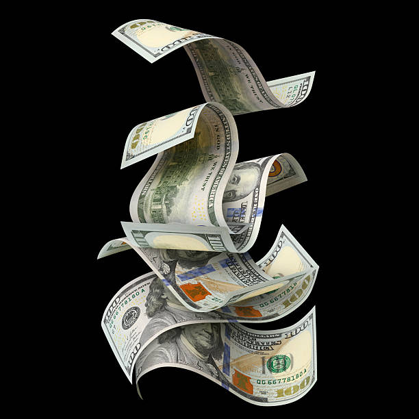 istock Flying hundred dollar bills, isolated on black background 2253689726