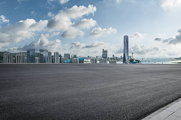 istock Empty asphalt road and modern city skyline with skyscrapers. 2253690130