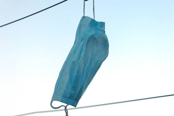 istock Disposable Face Mask Hanging on a Clothesline 2253690749