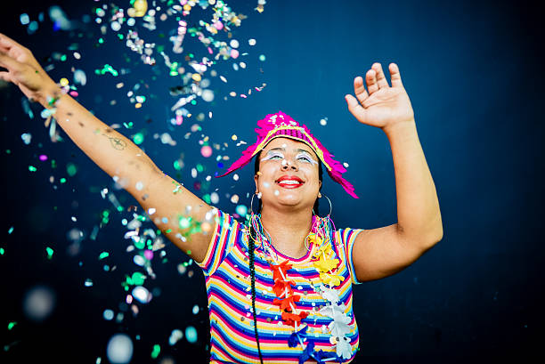 istock Happy young woman dancing enjoying Carnaval - Studio Shot 2253691016