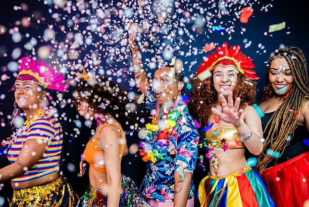 istock Excited friends dancing and enjoying Carnival - Studio Shot 2253691634