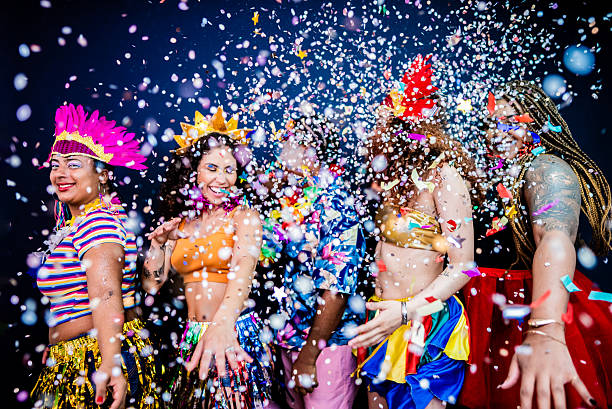 istock Excited friends dancing and enjoying Carnival - Studio Shot 2253691661
