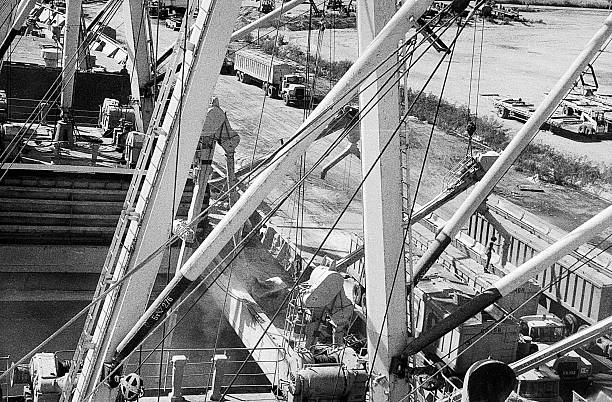 Puerto Cabello, Venezuela, - circa 1975: unloading of Mack trucks at port