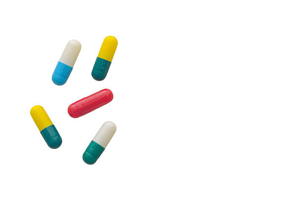 Yellow capsule on white background