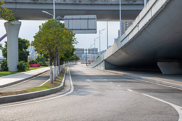 istock Urban highway overpass with modern cityscape 2253693464