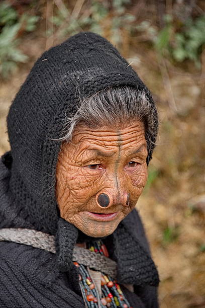 Ziro, India. February 06, 2016. Portrait of an elderly woman of the amazing Apatani tribe with a tattooed face. tattoos were applied as a protection against the theft of beauties by neighbors.