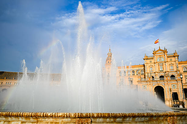 Sunset Rainbow at Vicente Traver Fountain: 4K View of the Iconic Plaza de España Architecture and Regionalist Design in Maria Luisa Park, Seville, Spain