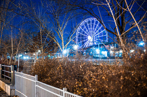 Ferris wheel at Montreal Old Port during night of winter