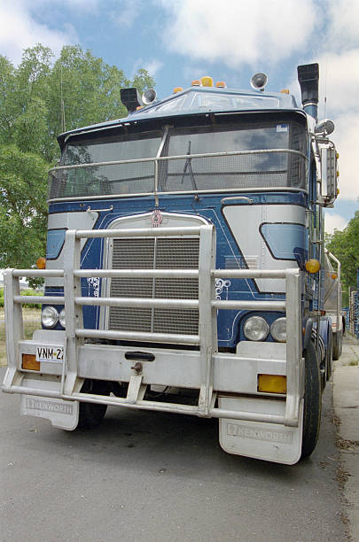 Historical photo from December 2001: The legendary US Kenworth K100 truck (1961–2002) with a cab-over-engine (COE) design in a parking lot in Sydney.