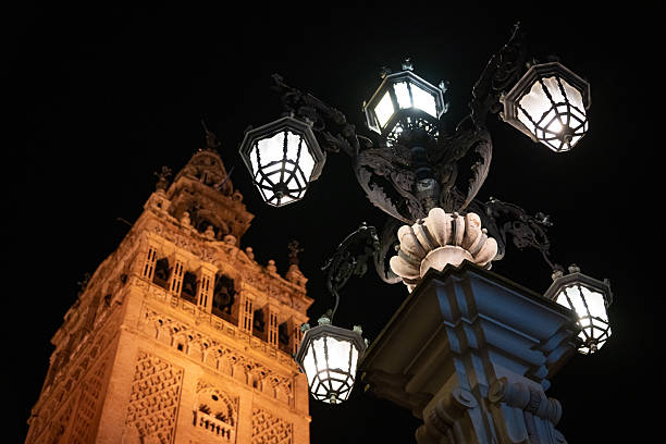 Illuminated Gothic Masterpiece: Seville Cathedral and Giralda Tower at Night, a UNESCO World Heritage Site and Iconic Landmark of Andalusia, Seville, Spain