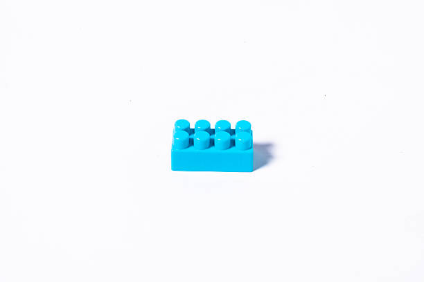 Single blue brick on white for creativity or education concept