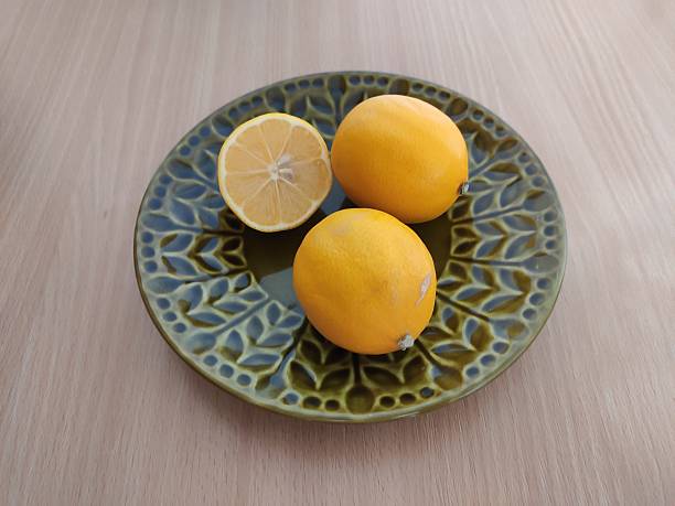 istock Fresh yellow lemons on the wooden table 2253701348