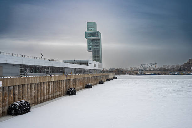 Wharf at the Montreal Old Port during a winter day with St. Lawrence river
