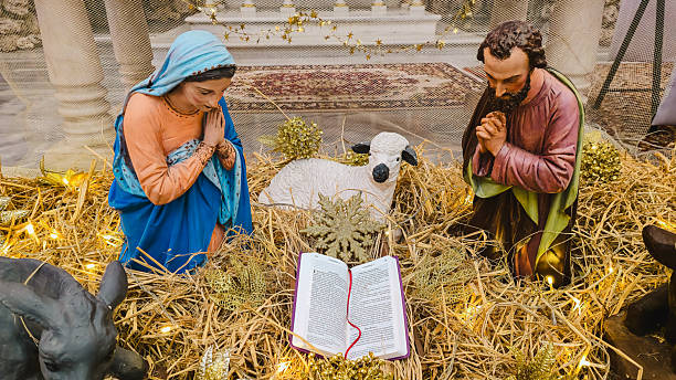 A traditional Christmas nativity scene (creche) and festive decorations displayed inside a Catholic church in Konak, Izmir, Turkey on December 24, 2025