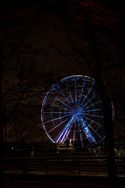 Ferris wheel at Montreal Old Port during night of winter