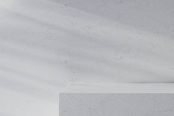 istock 3d Rendering Mockup Minimal Concrete Product Display Podium or Marble Concrete Product Display, Sunlight Shadow Palm Tree On Cement Wall or Marble wall, abstract Illustration Background 3d rendering. 2253705118